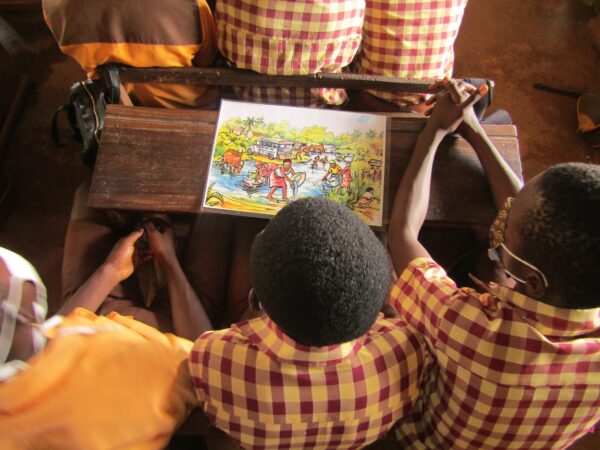 Students learning about the Safe Water Chain, and the various ways water can be contaminated. Image