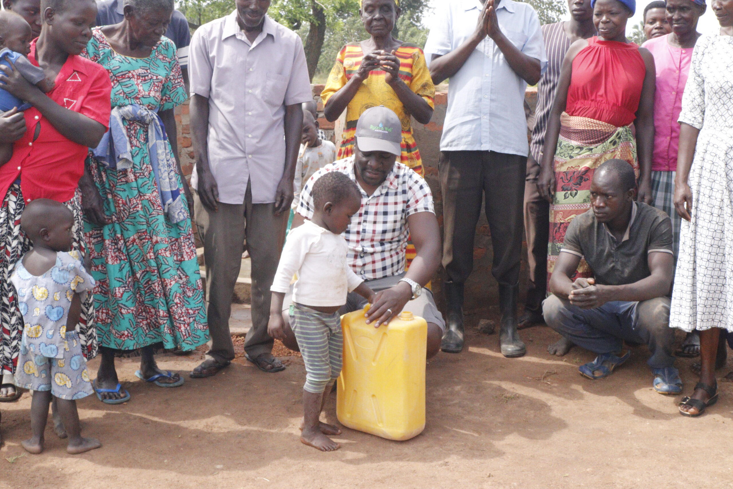 group standing around a water jug