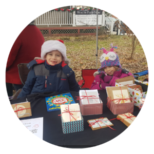 Logan and Alyx selling cards at the Merrickville Christmas Market